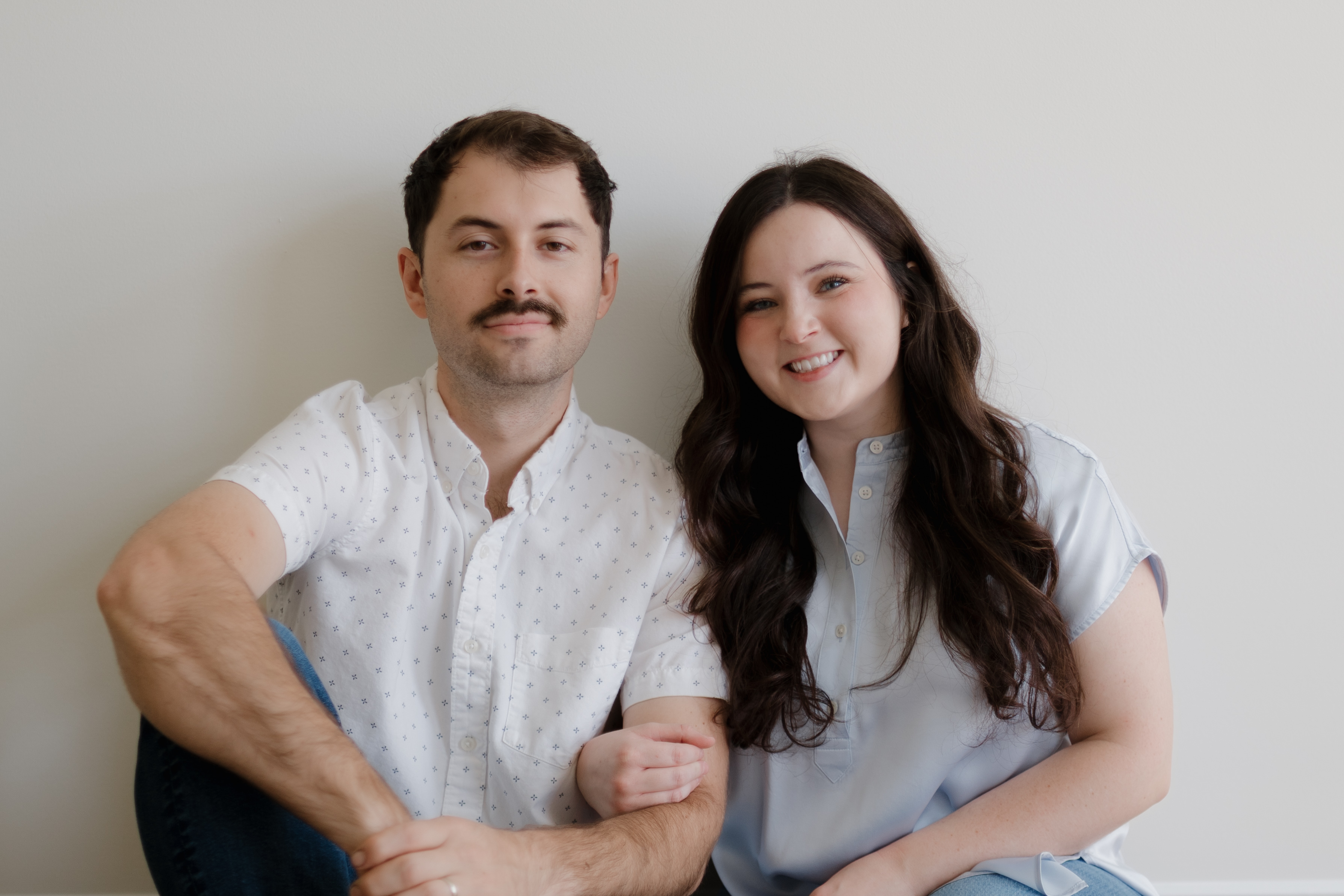 Claire and Nelson seated arm in arm